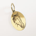 ciondolo ovale in argento bagnato in oro giallo con il ritratto dl tuo cavallo